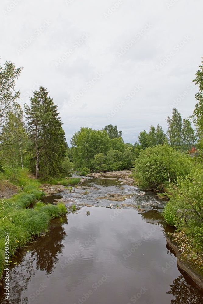 Landscape view of river Hirvihaaranjoki in cloudy summer weather, Hirvihaara, Mäntsälä, Finland.