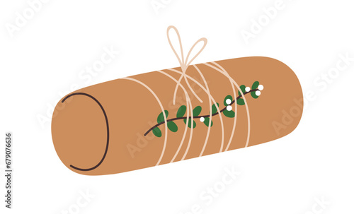 Holiday gift wrapped in brown kraft paper, decorated with eco green decor, na...