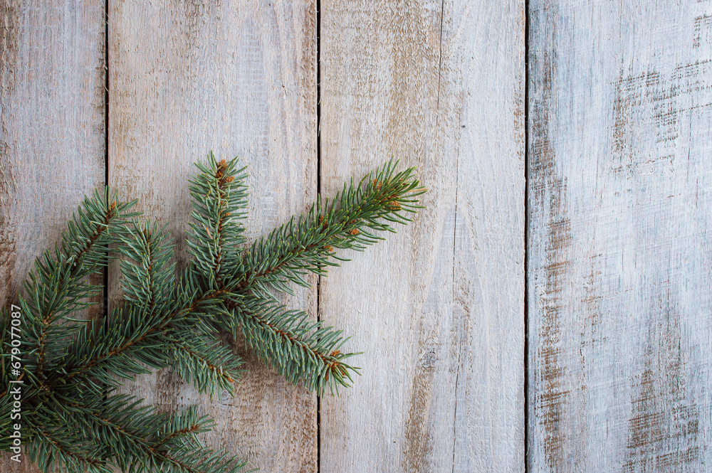 Pine tree branches, xmas symbol year celebration. Green fir branches on a wooden background. Christmas. Winter. Flat lay Pine tree branches, xmas symbol year celebration. Green fir branches on a wooden background. Christmas. Winter. Flat lay
