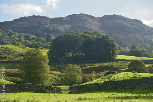 The small lake of Elterwater beneath the Langdale Pikes in the Lake District photo