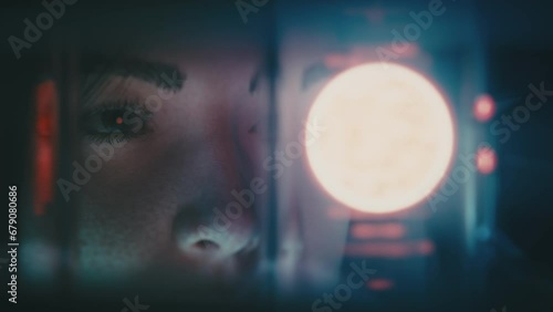 Woman looking at a plasma ball in a cold fusion chamber in a laboratory. Harnessed energy concept. Cold fusion infinite power, energy. Sci-fi cinematic animation. Nuclear fusion experiment. Futuristic photo