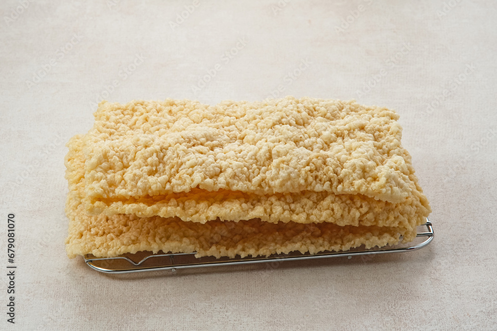 Fototapeta premium Kerupuk Gendar or Gendar Cracker, made from thinly shaped rice, dried and then fried. Indonesian food 