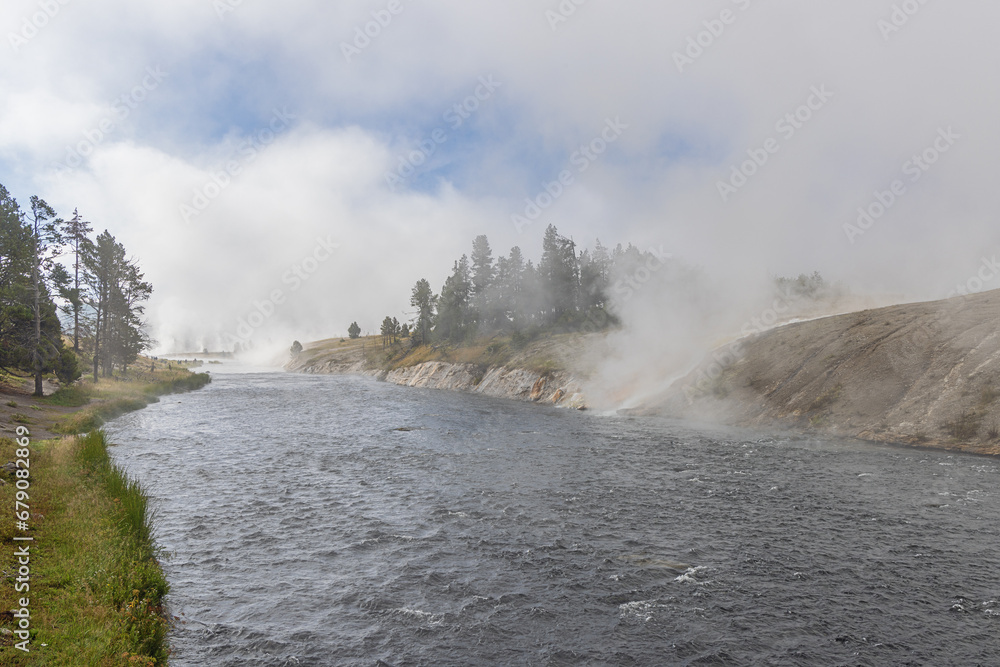 Fog banks over the Firehole River next to the Midway Geyser Basin in Yellowstone National Park