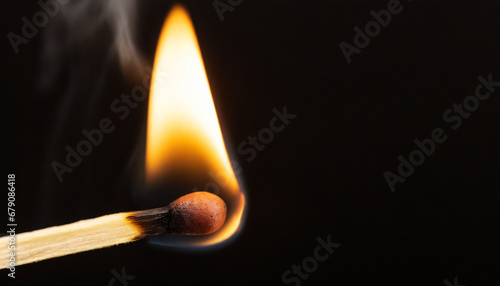 Macro photography of a burning match stick against black background