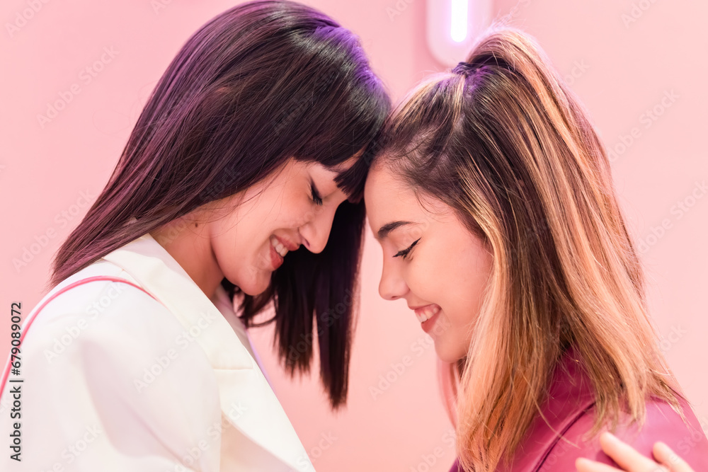 Happy young women embracing together Happy young women embracing together