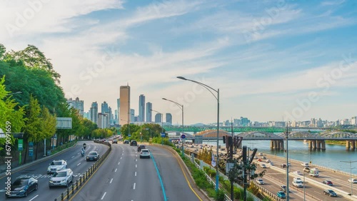 Time-lapse 4k Sunset 63 on the expressway bridge and Han River at the city in Seoul, South Korea, October 2, 2024.