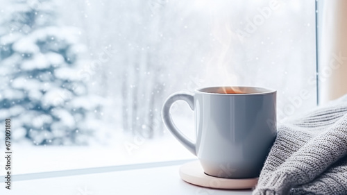 Winter holidays, calm and cosy home, cup of tea or coffee mug and knitted blanket near window in the English countryside cottage, holiday atmosphere