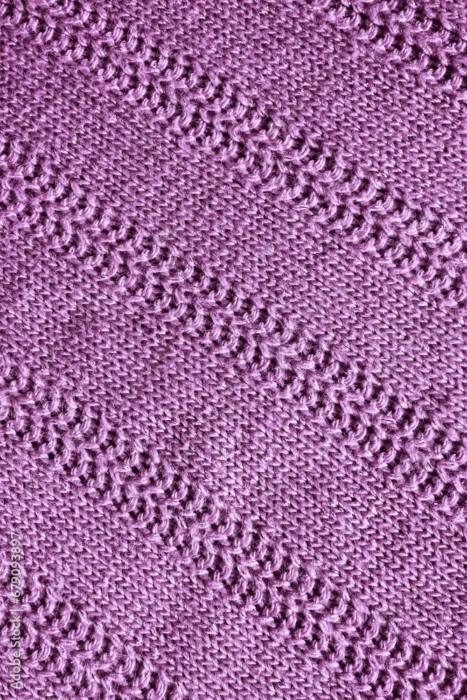 lilac knitted texture. Abstract background, pattern, ornament. Detail of a warm winter sweater.
