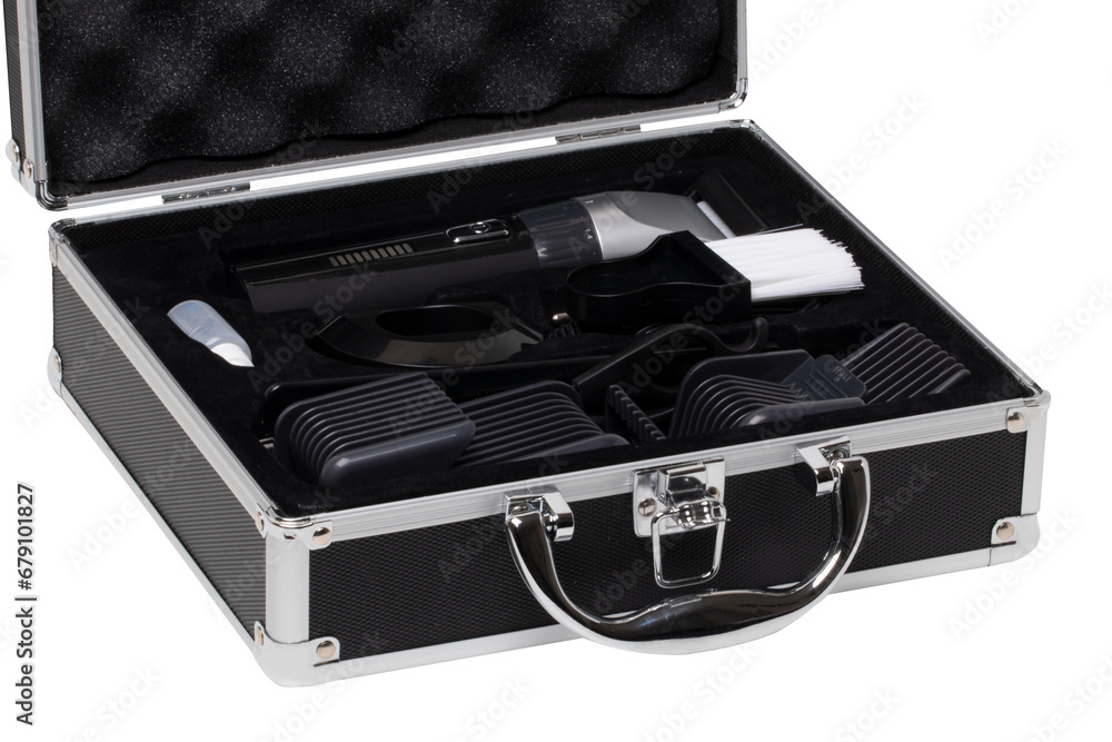 Closeup of a opened small black silver equipment case or suitcase with professional hairdresser's set isolated on a white background. Closeup of a opened small black silver equipment case or suitcase with professional hairdresser's set isolated on a white background.