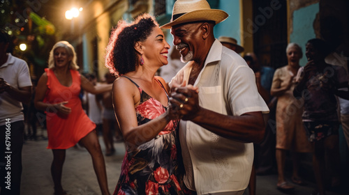 Cuban couple dance a romantic traditional salsa in a Cuban street photo