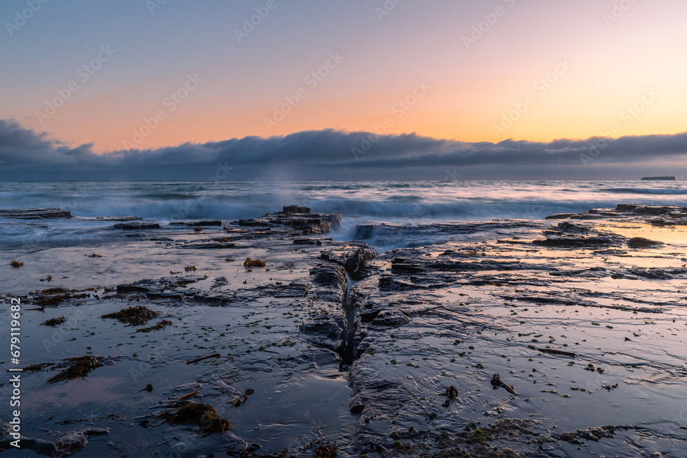 Sunrise view from the rocky coastline. Sunrise view from the rocky coastline.
