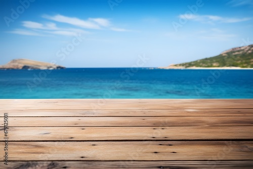 close up of a wooden table with ocean sea view in background