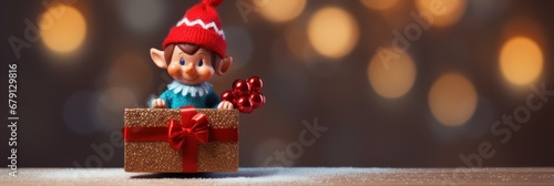 Christmas toy elf holding a gift box photo