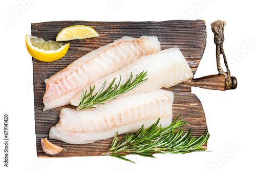Raw cod fish fillets, codfish with rosemary on wooden board.  Transparent background. Isolated. photo