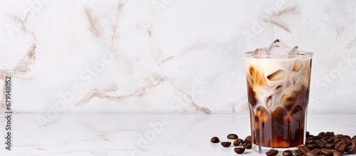 Icy milk coffee on marble table Copy space image Place for adding text or design