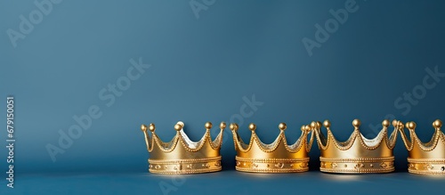 Fotografia January 6th celebration with three gold crowns on blue background for Dia de Rey