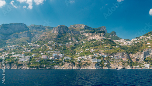 A trip to the Amalfi Coast on a summer's day, blue sky. View of the idyllic houses on the cliff. Italy.