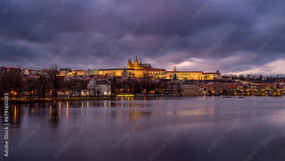 View of Prague Castle with Charles Bridge on a winter night