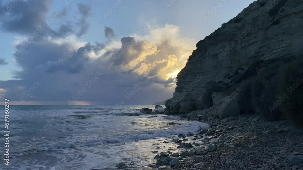 Dramatic sunset at the beach with rocks Dramatic sunset at the beach with rocks