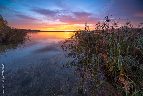Clear Calm Lake with Reeds at Sunrise © AVTG