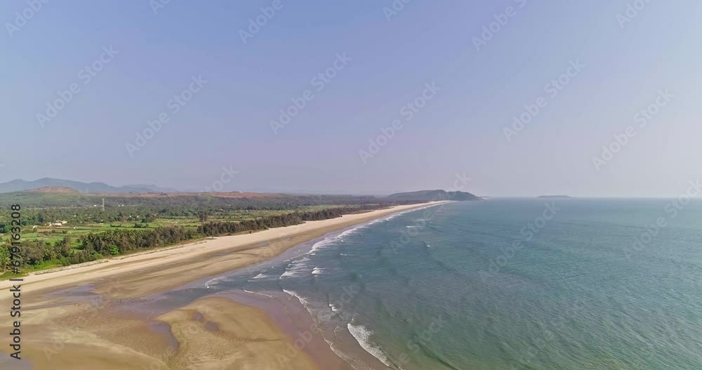 An aerial shot of a deserted, empty coastline along a rural shore An aerial shot of a deserted, empty coastline along a rural shore