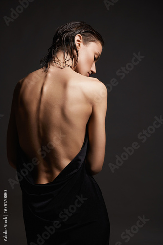 Naked Female back. young wet woman in the towel. Beautiful sexy Girl with wet Hair