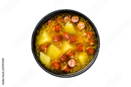 Split pea soup with smoked sausages in a pan. Transparent background. Isolated.