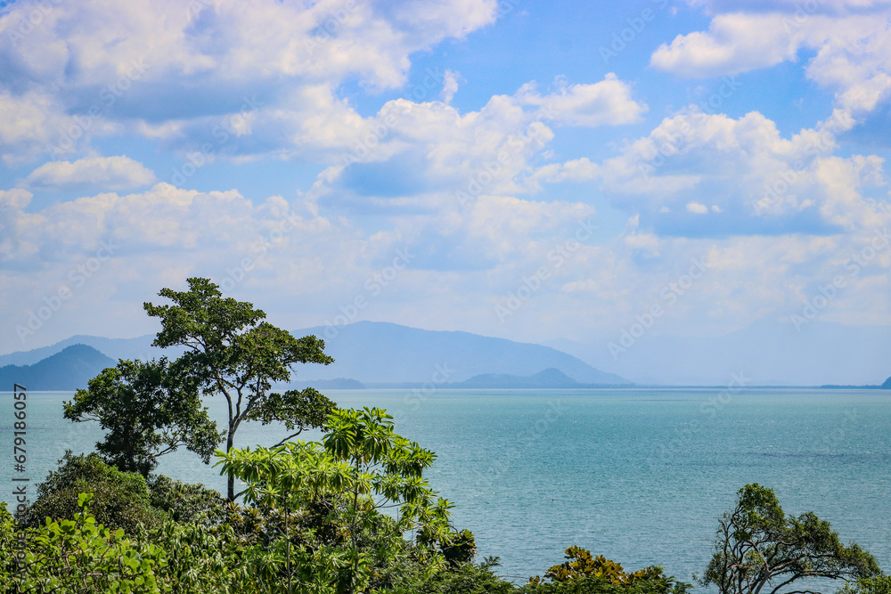 Obraz premium Top view of jungle, beautiful turquoise sea on tropical island. Concept of travel, relaxation, vacation.