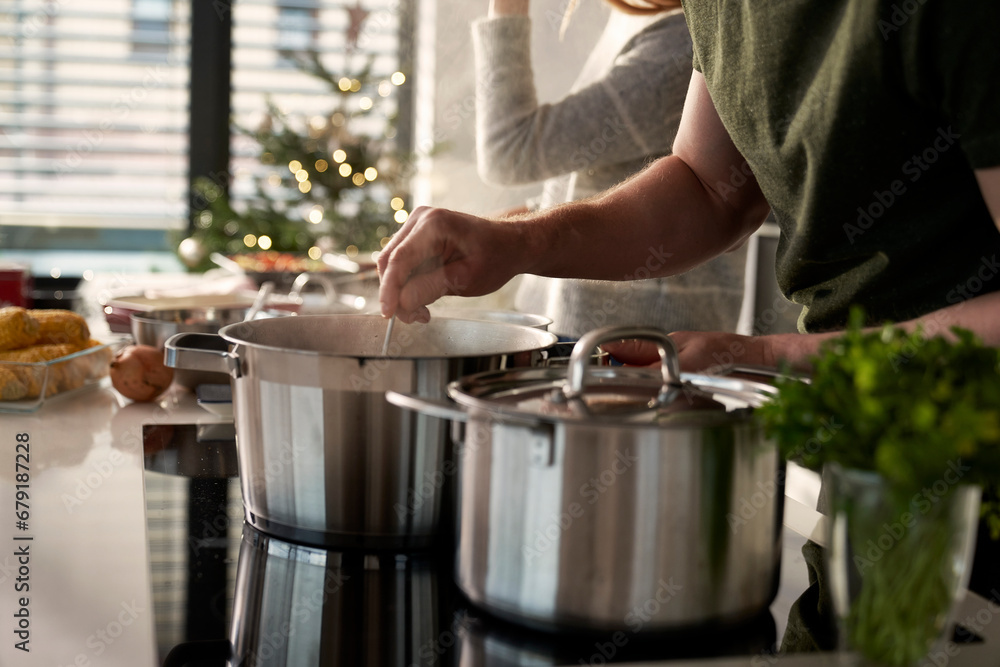 Caucasian couple preparing food before Christmas Caucasian couple preparing food before Christmas