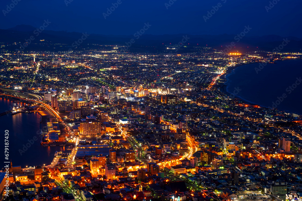 Fototapeta premium sunset or sun rise of Hakodate cityscape with Skyline and office building and downtown of Hakodate is populars ciy from toursim Hokkaido, Japan with twilight sky in spring season