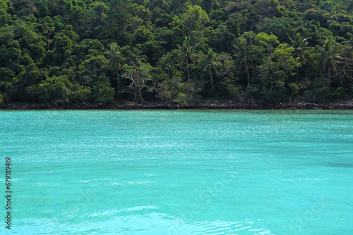 Crystal clear waters and shade of coconut trees on the Koh Talu Island Bang Saphan Noi Prachuap Khiri Khan Thailand 