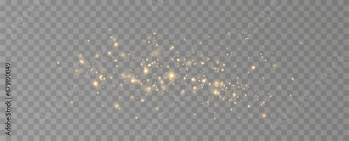 Golden sequins glow with many lights. Glittering dust. Luxurious background of golden particles.