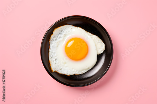 Fried egg isolated on pink background