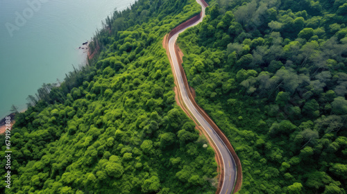 view of highway in the mountains, Top view of countryside road passing through the green forrest and mountain, aerial view