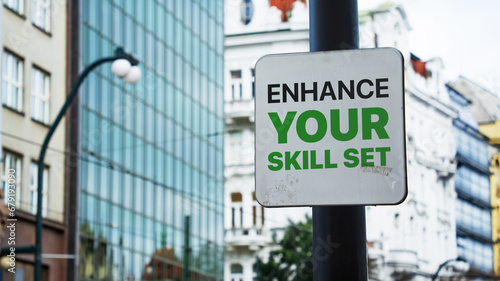 Enhance your skill set written on a sign in front of office buildings photo