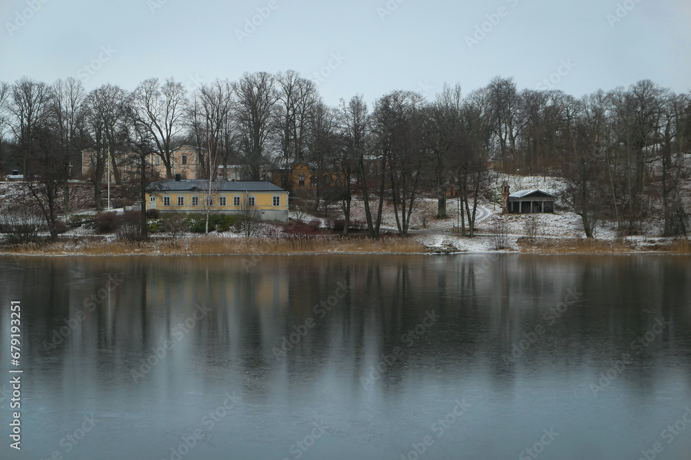 Scenic view of river by building against sky Scenic view of river by building against sky