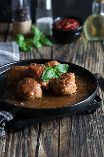Meatballs with tomato sauce . on a wooden table. dinner