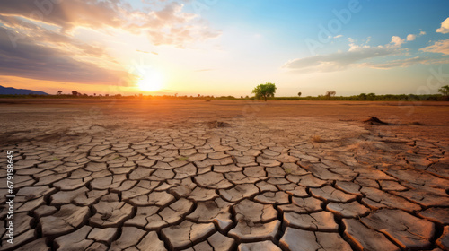 Drought stricken farmland with cracked soil, dry weather