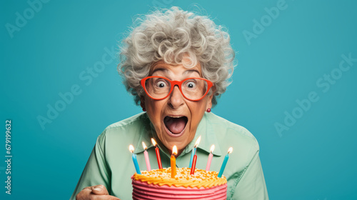 Elderly woman with joyful crazy look is celebrating her birthday