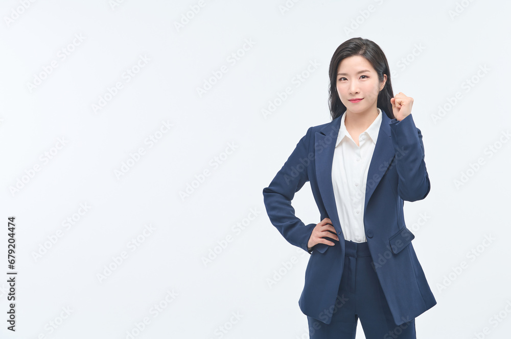 A young businesswoman in a suit is making various facial expressions and gestures. A young businesswoman in a suit is making various facial expressions and gestures.