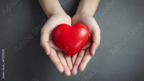 Red heart in woman hands. Love  valentine s day background. 