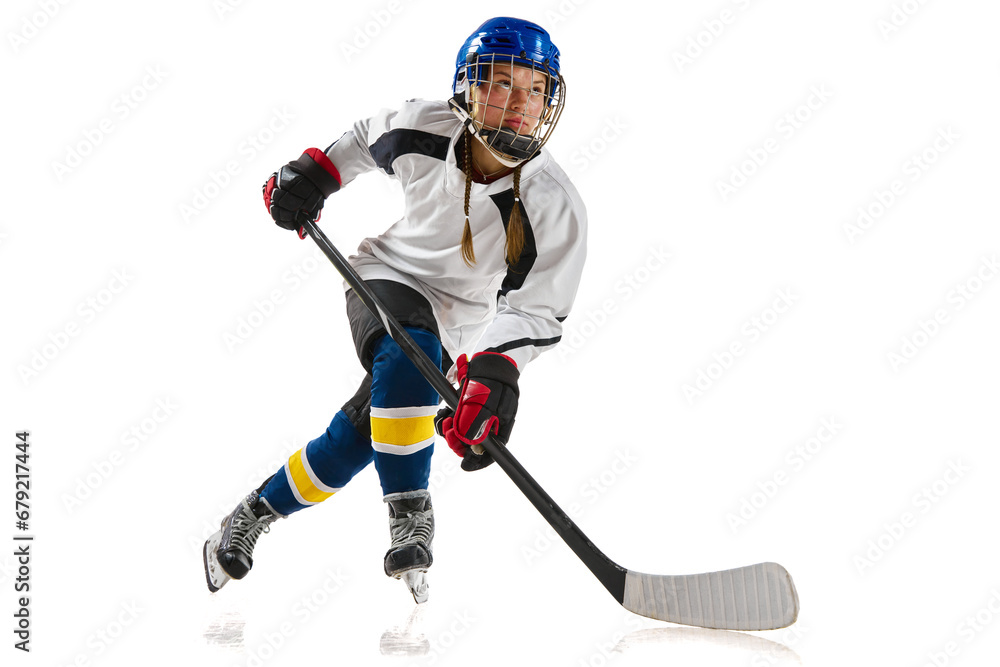 Young girl, athlete, hockey player in motion, training, playing isolated over white background. Championship. Concept of professional sport, competition, game, action and hobby Young girl, athlete, hockey player in motion, training, playing isolated over white background. Championship. Concept of professional sport, competition, game, action and hobby