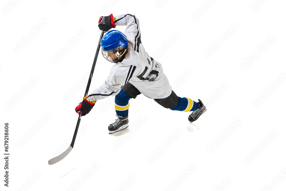 Obraz premium Top view image of young girl, hockey player in motion during game, training, playing isolated over white background. Concept of professional sport, competition, game, action, hobby