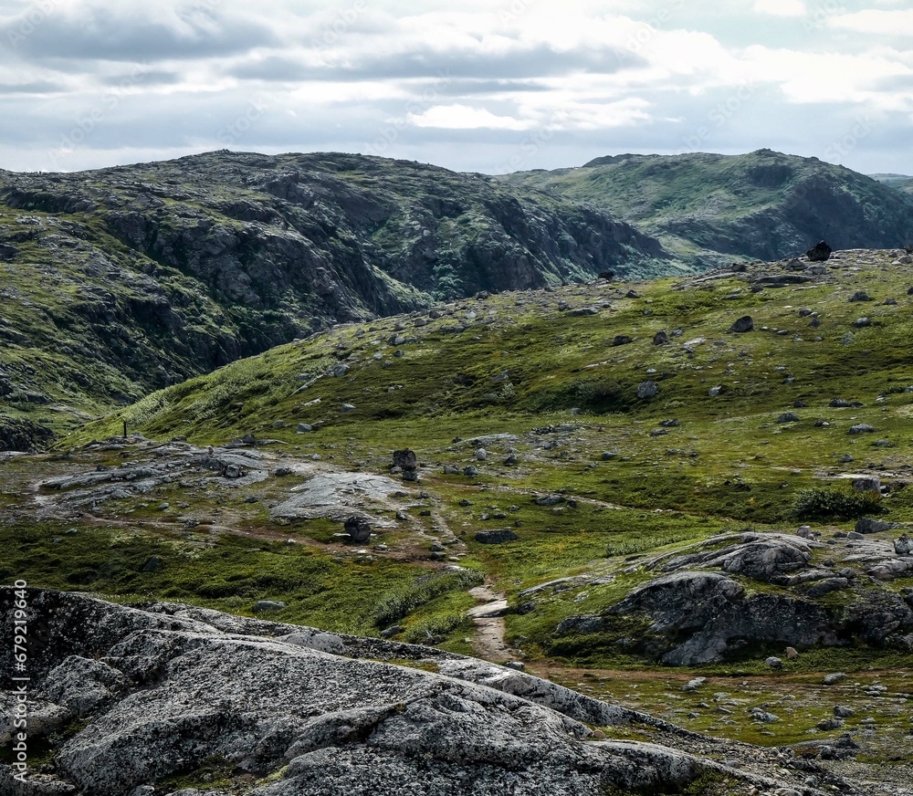 Landscape of green polar rocky tundra. Northern nature of Teriberka Landscape of green polar rocky tundra. Northern nature of Teriberka