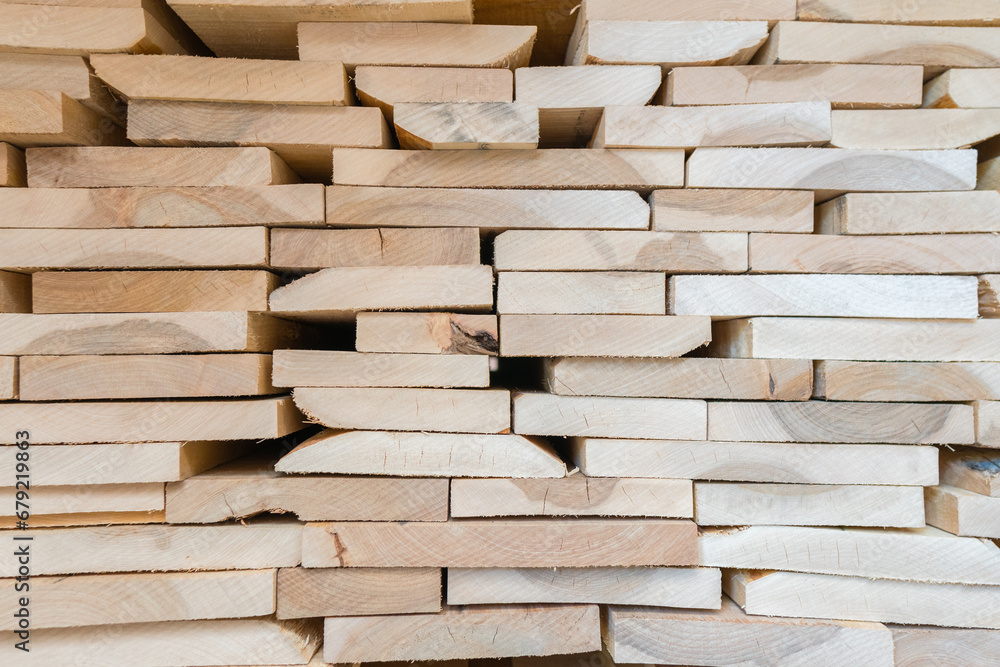 Stacks of lumber being stored in a warehouse Stacks of lumber being stored in a warehouse