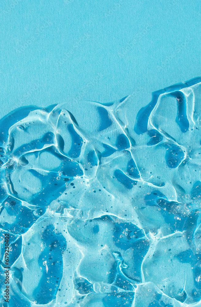 texture gel serum on blue background closeup