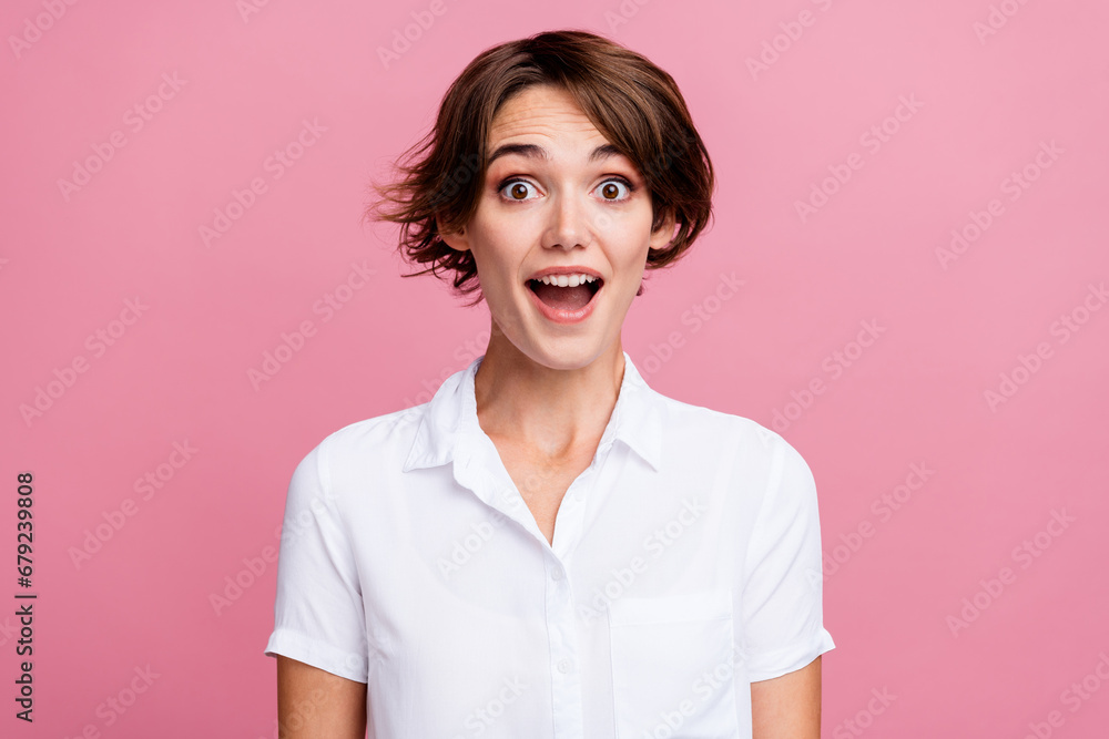 Photo of impressed nice positive woman with bob hairdo dressed white shirt staring at big season sale isolated on pink color background Photo of impressed nice positive woman with bob hairdo dressed white shirt staring at big season sale isolated on pink color background