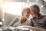 An elderly couple in love, a man and a woman in bed in the morning. Love and romance of two people. Tenderness and relaxation. Happy morning for lovers. Valentine's Day.