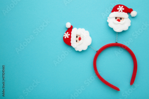 Wallpaper Mural Christmas headband Santa Claus head design on blue background. Space for text Torontodigital.ca