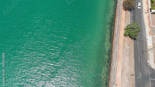 Drone footage of coastal buildings and Urangan Pier (end) in Esplanade, Urangan QLD, Australia photo